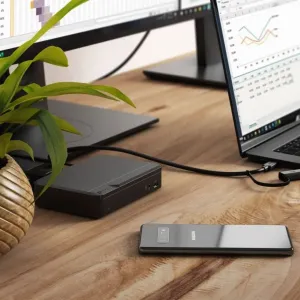 ALOGIC USB-C dual monitor docking station in black on a desk, connected to a laptop and monitor