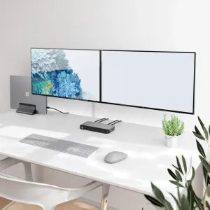 Alogic PRIME MX2 Universal Dock auf einem Schreibtisch mit angeschlossenen USB-C-Kabeln und zwei Monitoren in einer aufgeräumten Arbeitsplatzumgebung