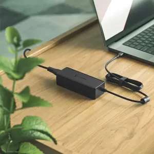 ALOGIC 100W USB-C PD inline GaN power adapter connected to a laptop on a desk