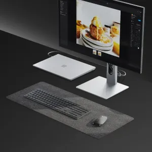 ALOGIC Echelon kabelloses Tastatur- und Maus-Set auf einer Schreibtischunterlage neben einem Monitor und Laptop