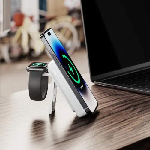 ALOGIC Lift MagSafe compatible power bank with stand, charging a phone and smartwatch on a desk