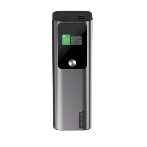 Sidabrinės spalvos "ALOGIC Ark powerbank" su juodu priekiniu skydeliu, nedideliu ekranu ir apvaliu mygtuku, prievadais ir ventiliacijos angomis viršuje.