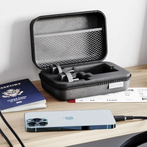 ALOGIC Rapid Power GaN 67W travel case open on table, with two interchangeable foam inlay power adapters and braided USB-C cable.