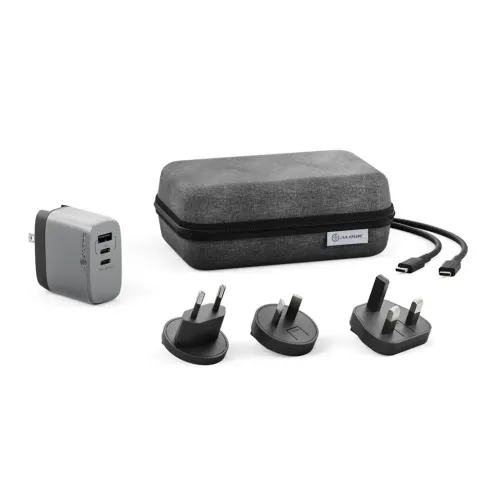 Universal charger in gray with USB ports and US plug, three travel adapters, dark gray zippered case and USB-C cable.